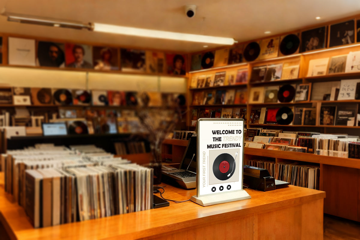 desktop rechargeable light box used on a record store table to display album promotional content