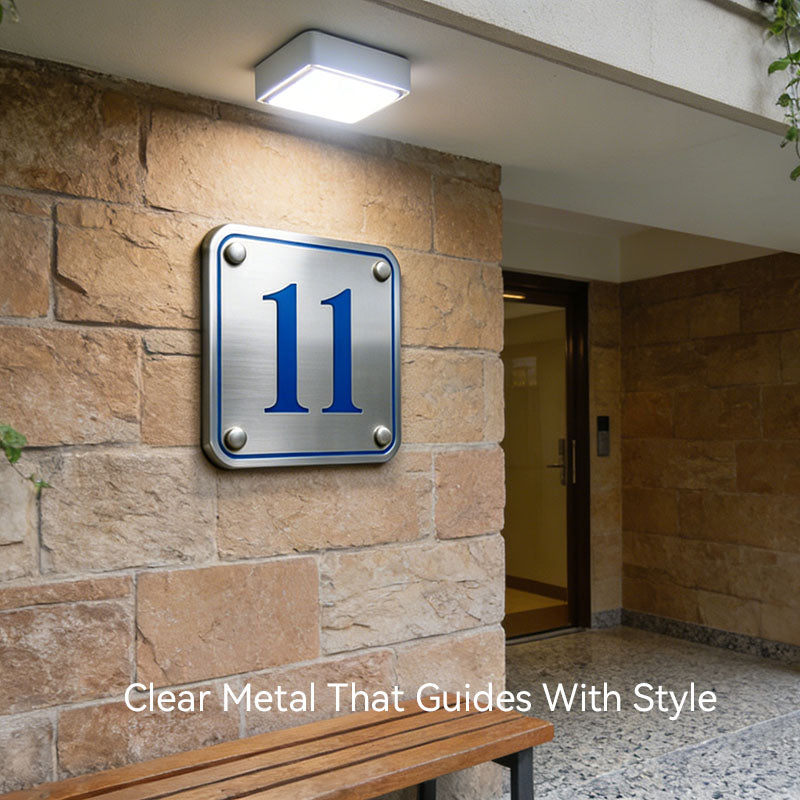 custom 3D metal sign installed on storefront entrance for directional guidance
